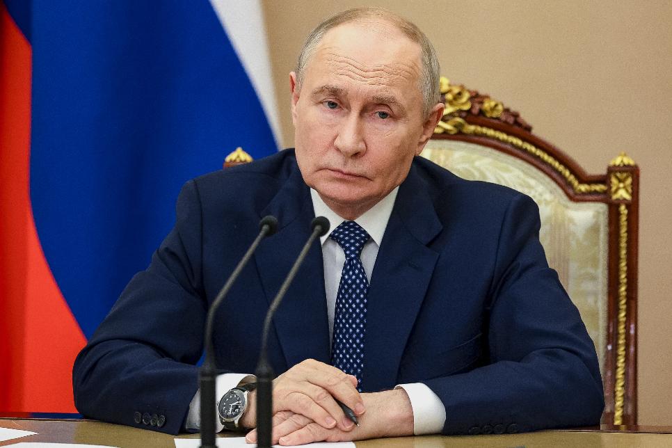 Russian President Vladimir Putin chairs a meeting on measures to support relatives of those killed and injured in the attack on a college in Starobilsk, of the Russia-controlled Luhansk region of Ukraine, at the Kremlin in Moscow, Monday, June 1, 2026. (Vyacheslav Prokofyev/Sputnik, Kremlin Pool Photo via AP)