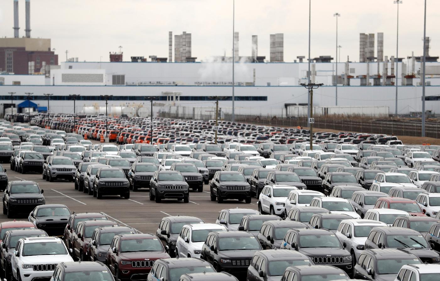 FILE - In this Feb. 26, 2019, file photo, Jeep vehicles are parked outside the Jefferson North Assembly Plant in Detroit. (AP Photo/Carlos Osorio, File)