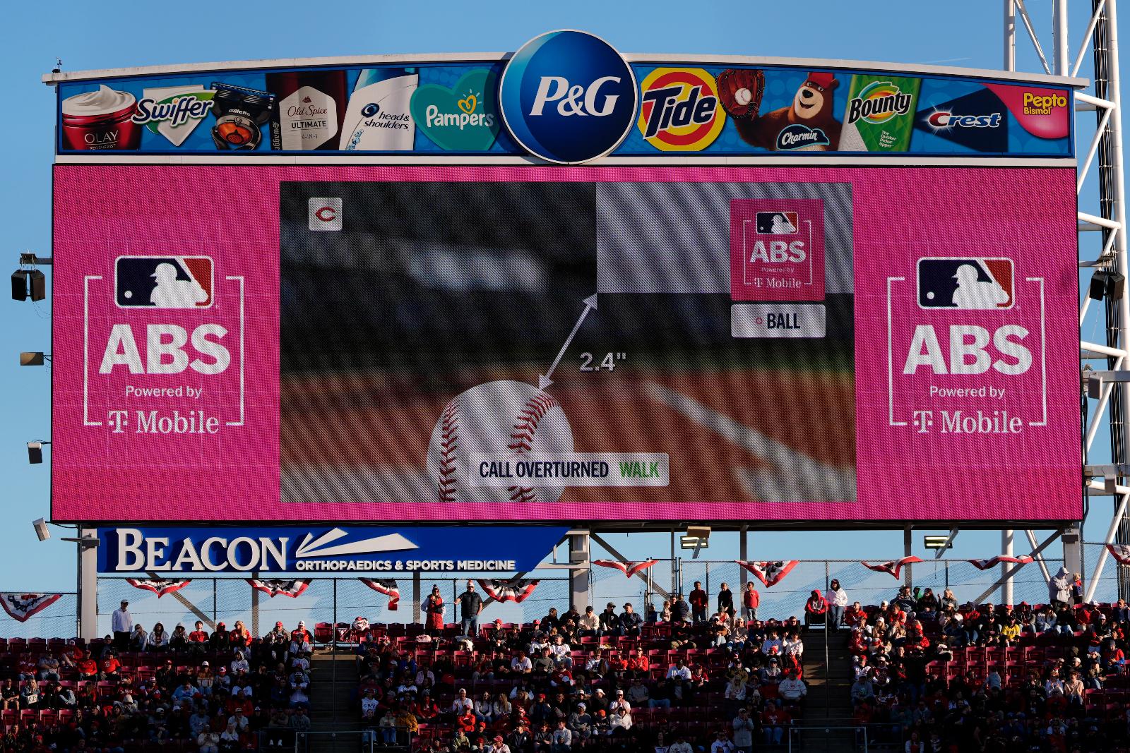 A call is overturned to a walk by the Automated Ball-Strike (ABS) Challenge System, displayed on the stadium screens, after Cincinnati Reds' Will Benson challenged at pitch result during the seventh inning of a baseball game against the Boston Red Sox in Cincinnati, Saturday, March 28, 2026. (AP Photo/Carolyn Kaster)