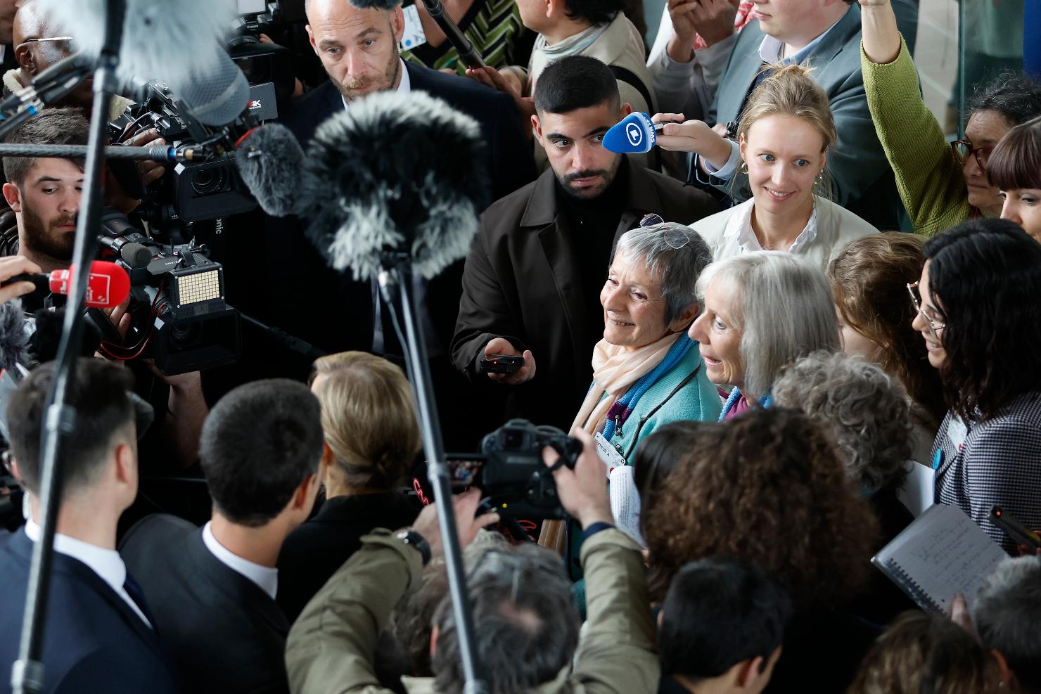Swiss members of Senior Women for Climate Protection answer reporters after the European Court of Human Rights ruling, Tuesday, April 9, 2024 in Strasbourg, eastern France. Europe's highest human rights court ruled that its member nations have an obligation to protect their citizens from the ill effects of climate change, but still threw out a high-profile case brought by six Portuguese youngsters aimed at forcing countries to reduce greenhouse gas emissions. (AP Photo/Jean-Francois Badias)
