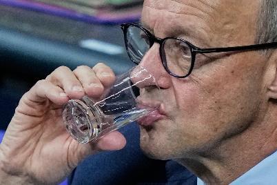 German Chancellor Friedrich Merz attends a meeting of the German Parliament in Berlin, Germany, Friday, Dec.5, 2025. (AP Photo/Ebrahim Noroozi)