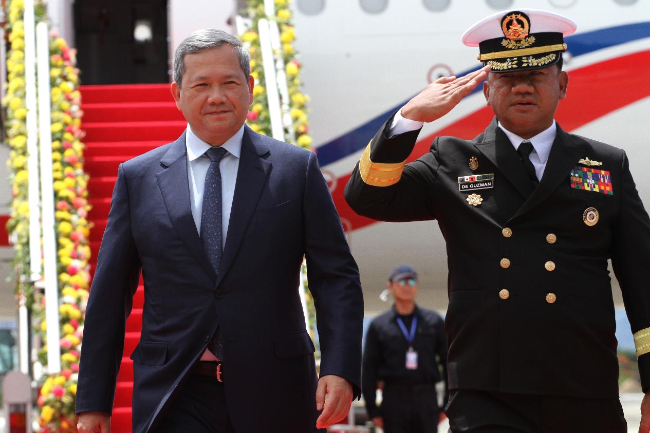 Cambodia's Prime Minister Hun Manet, left, arrives ahead of the 48th ASEAN Summit and Related Meetings in Cebu province, central Philippines on Thursday, May 7, 2026. (AP Photo/Jacqueline Hernandez, Pool)
