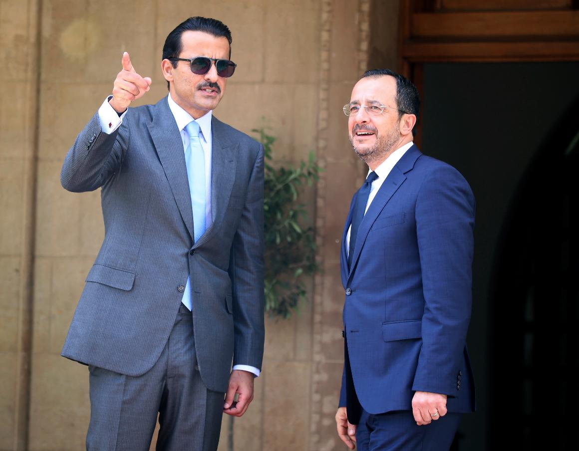 Cyprus' President Nikos Christodoulides, right, speaks to Qatar's Emir Sheikh Tamim bin Hamad al-Thani prior to their meeting at the presidential palace in Nicosia, Cyprus, Tuesday, May 28, 2024. Qatar's Emir is in Cyprus for an official visit. (AP Photo/Philippos Christou)