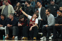 NBA fans sit courtside during the first half of an NBA basketball game between the Phoenix Suns and the Cleveland Cavaliers, Friday, Jan. 30, 2026, in Phoenix. (AP Photo/Ross D. Franklin)