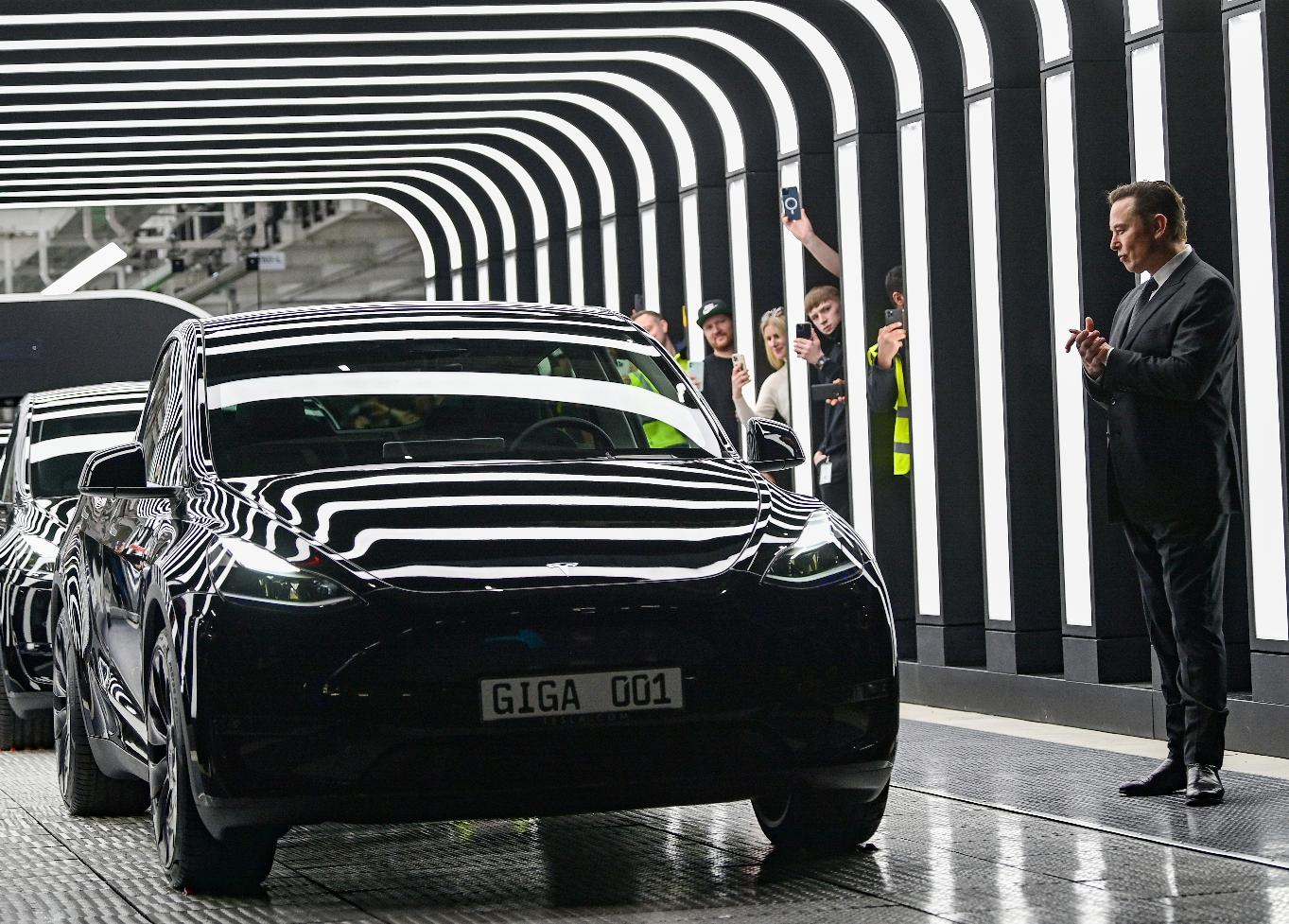 FILE - Tesla CEO Elon Musk claps hands at the opening of the Tesla factory Berlin Brandenburg in Gruenheide, Germany, Tuesday, March 22, 2022. Tesla production stands still because of The armed conflicts in the Red Sea and the associated shifts in transport routes between Europe and Asia. (Patrick Pleul/Pool via AP, File)