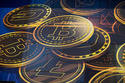 FILE - An advertisement for the cryptocurrency Bitcoin is displayed on a building in Hong Kong on Nov. 18, 2021. (AP Photo/Kin Cheung, File)
