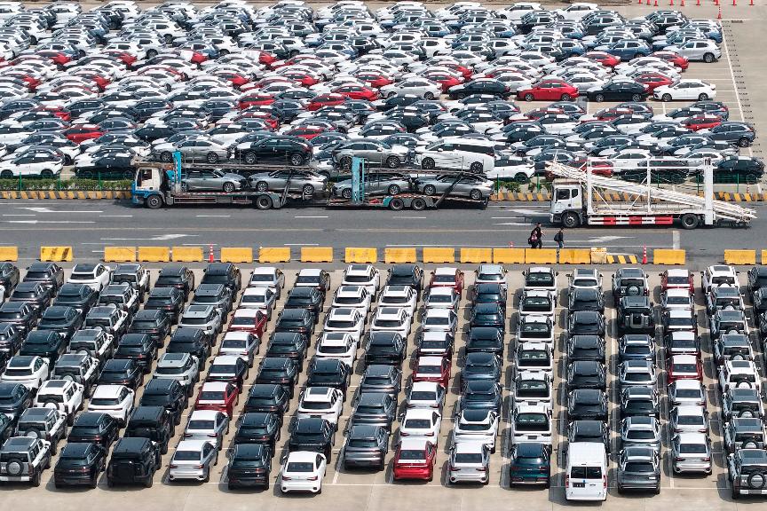Aerial view of new vehicles waiting for shipment to overseas market at a port in Shanghai, China Saturday, May 9, 2026.(Chinatopix via AP)