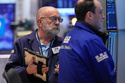 Trader Joseph Stevens, left, works on the floor of the New York Stock Exchange, Tuesday, May 5, 2026. (AP Photo/Richard Drew)