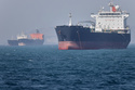 Oil tankers sit at anchor offshore in the Strait of Hormuz off Bandar Abbas, Iran, Saturday, May 2, 2026. (Amirhosein Khorgooi/ISNA via AP)
