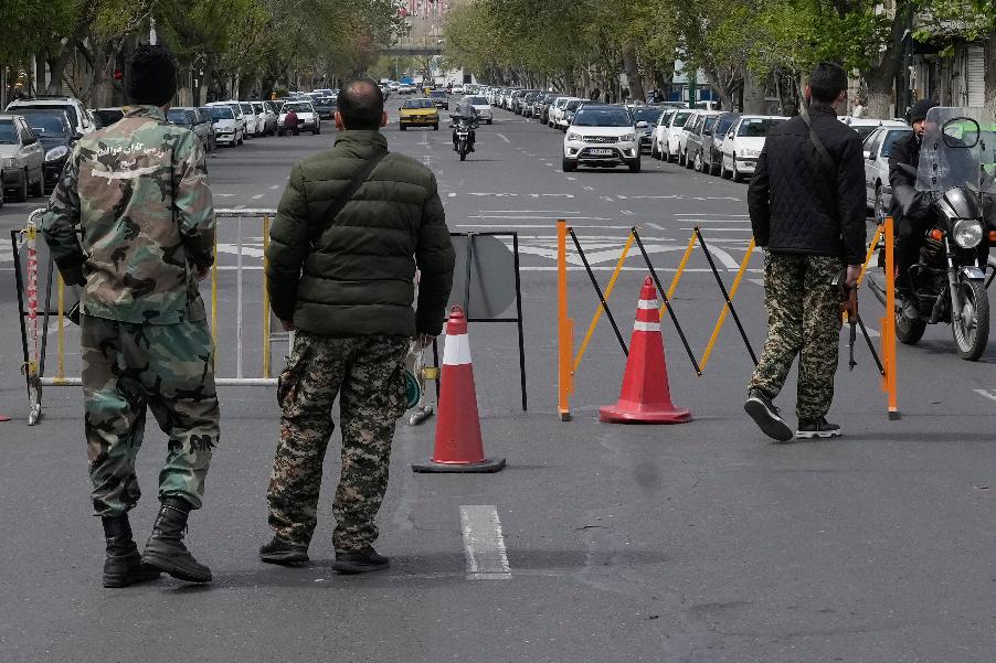 Members of the Basij paramilitary force stand at a checkpoint in Tehran, Iran, Sunday, March 29, 2026. (AP Photo/Vahid Salemi)