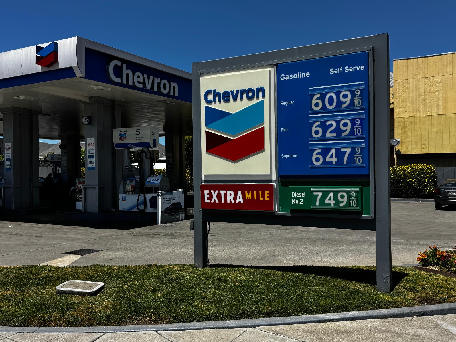 A billboard shows gas prices at a Chevron gas station in Alameda, Calif., on Thursday, May 21, 2026, where company signs blame Sacramento policies for high fuel costs. (AP Photo/Terry Chea)