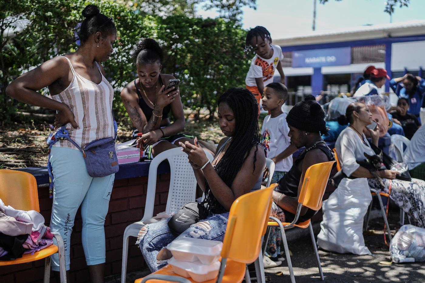 People affected by the earthquake wait for treatment at a health post three days after it hit Cali, Colombia, Thursday, Aug. 13, 2026. (AP Photo/Ivan Valencia)