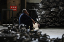 FILE - A worker takes a rest at a factory making steel bike rims for export to U.S., in Hangzhou in east China's Zhejiang province, on Friday, April 11, 2025. (Chinatopix Via AP, File)