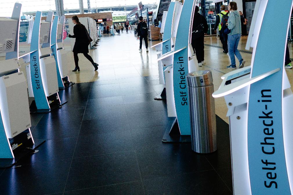 Check-in counters at a terminal at Berlin's Brandenburg airport, in Schönefeld, Germany, Saturday Sept. 20, 2025, after a cyberattack targeting check-in and boarding systems disrupted air traffic at several major European airports. (Carsten Koall/dpa via AP)
