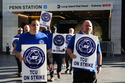 Long Island Rail Road workers walk on the picket line outside of Penn Station on the first day of their strike, Saturday, May 16, 2026, in New York. (AP Photo/Heather Khalifa)