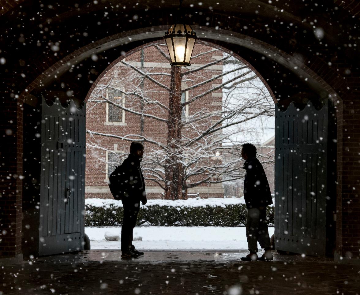 FILE - Wheaton College students stop to chat on the Norton, Mass. campus, Feb. 13, 2024 as snow falls. (Mark Stockwell/The Sun Chronicle via AP, File)