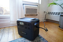 A battery from Every Electric to power an air conditioner as part of a pilot program with the city's energy company Con Edison to reduce pressure on the electrical grid sits on an apartment floor Monday, April 27, 2026, in the Brooklyn borough of New York. (AP Photo/Alyssa Goodman)
