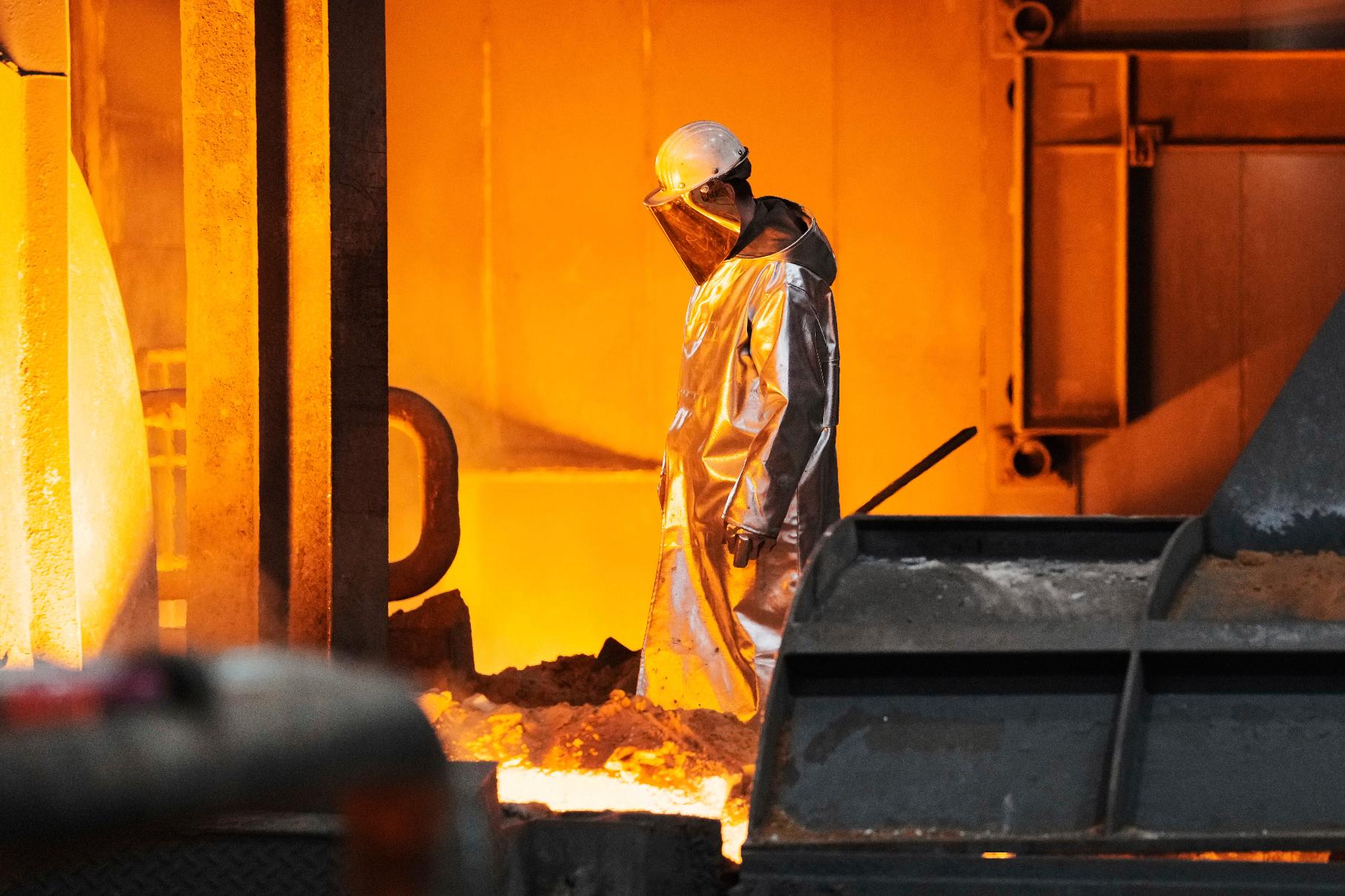 A steel worker is seen during a visit of EU Commissioner for Prosperity and Industrial Strategy Stephane Sejourne at the Thyssenkrupp steelworks in Duisburg, Germany, after the EU Steel Action plan was presented, Thursday, March 20, 2025. (AP Photo/Martin Meissner)