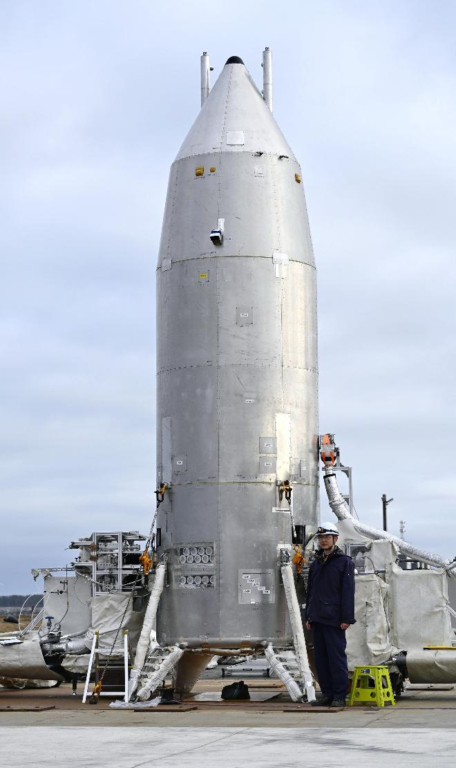 This photo shows the Reusable Vehicle eXperiment, known as RV-X, at the Noshiro Rocket Testing Center of the Japan Aerospace Exploration Agency, in Noshiro, northern Japan, March 14, 2026. (Muneyoshi Someya/Kyodo News via AP)