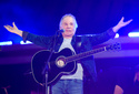 FILE - Singer-songwriter Paul Simon performs at Global Citizen Live in Central Park on Sept. 25, 2021, in New York. (Photo by Evan Agostini/Invision/AP, File)