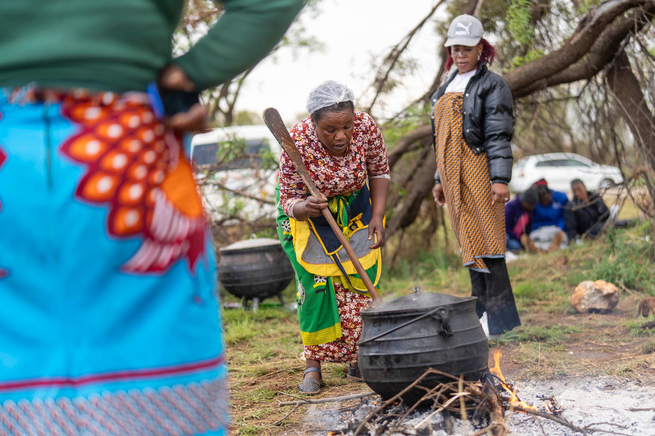 Relatives of miners and community members wait near the shaft of a closed mine where illegal miners are inside in Stilfontein, South Africa, Thursday, Nov. 14, 2024. (AP Photo/Jerome Delay)