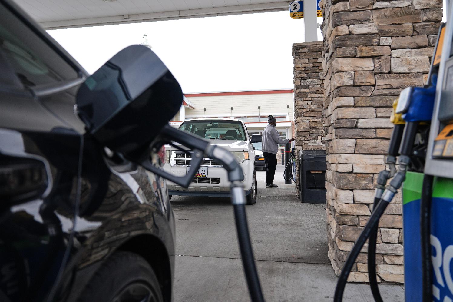 FILE - A person fuels their vehicle at a gas station March 19, 2026, in Baltimore. (AP Photo/Stephanie Scarbrough, File)