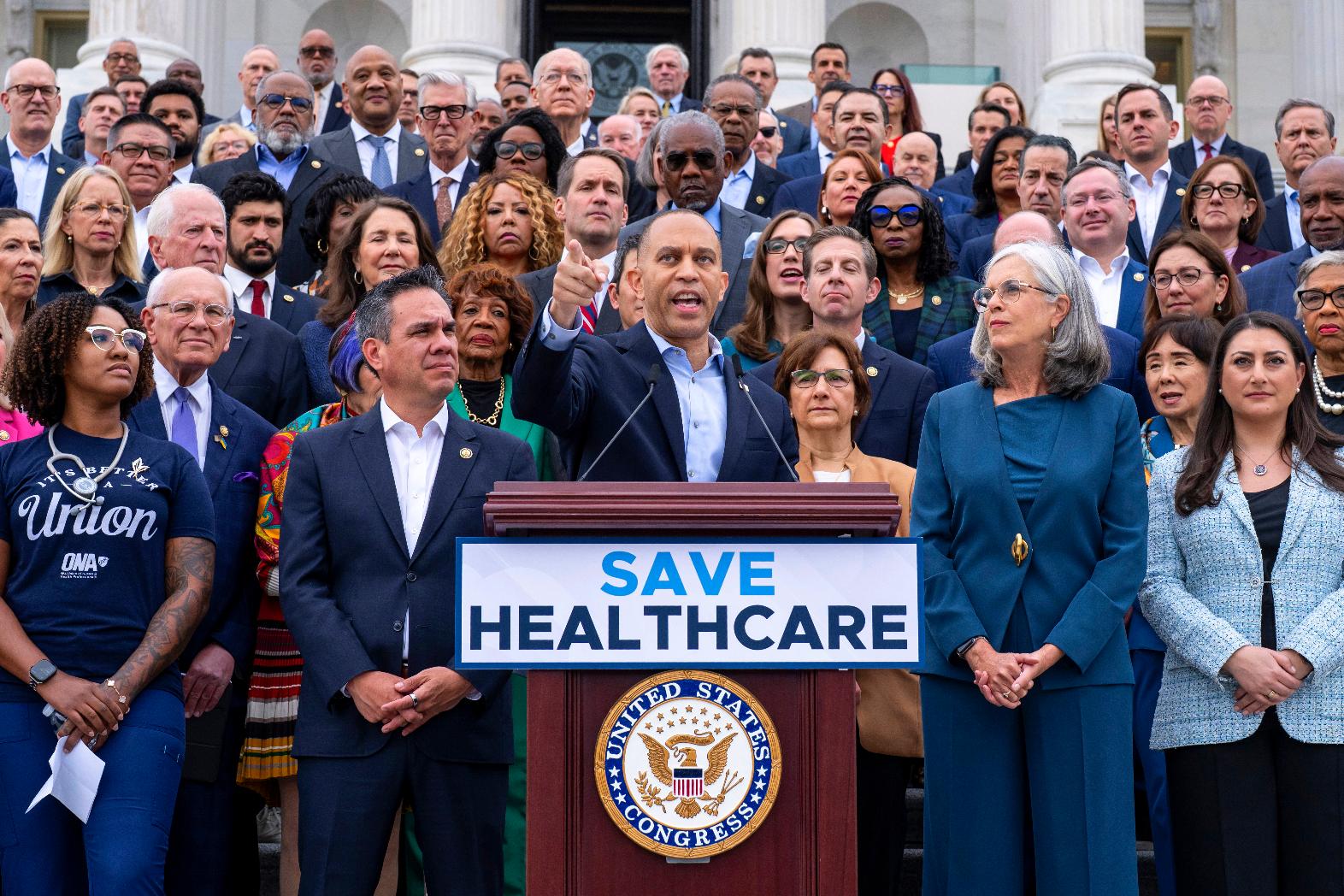 House Minority Leader Hakeem Jeffries, D-N.Y., center, flanked by Rep. Pete Aguilar, D-Calif., left, and Rep. Katherine Clark, D-Mass., arrives to speak on the steps of the Capitol to insist that Republicans include an extension of expiring health care benefits as part of a government funding compromise, in Washington, Tuesday, Sept. 30, 2025. (AP Photo/J. Scott Applewhite)