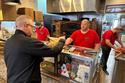 A man pays for pizza at Lo Duca Pizza, May 12, 2026, in the Brooklyn borough of New York. (AP Photo/David R. Martin)