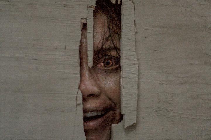 This image released by Warner Bros. Pictures shows Luciane Buchanan in a scene from "Evil Dead Burn." (Warner Bros. Pictures via AP)