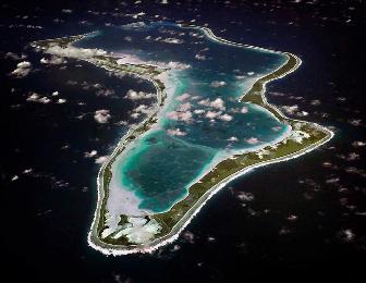 FILE - This image released by the U.S. Navy shows an aerial view of Diego Garcia in the Chagos Island group. (U.S. Navy via AP, File)
