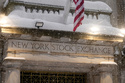Snow falls outside the New York Stock Exchange, Monday, Feb. 23, 2026, in New York. (AP Photo/Seth Wenig)