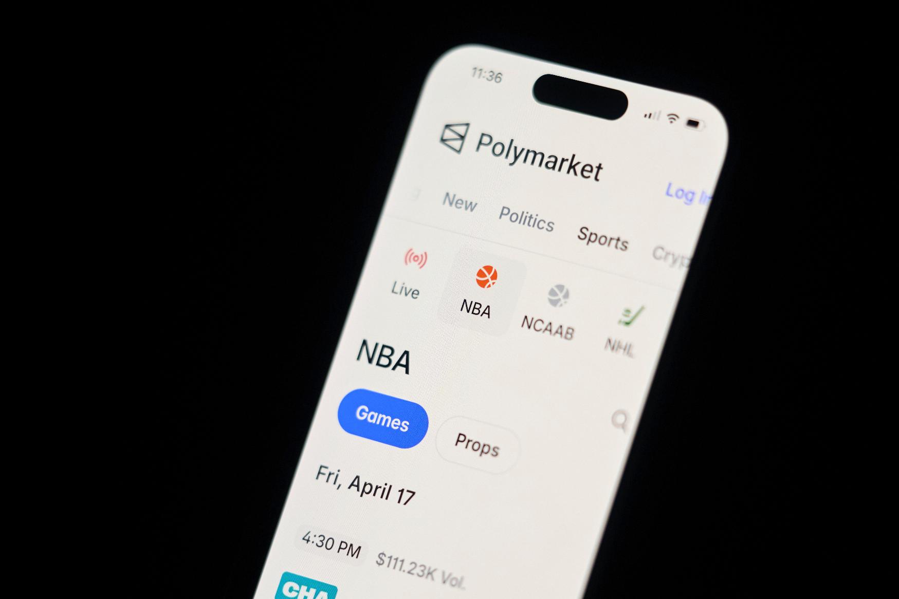 A phone displays sports trades on Polymarket on Thursday, April 16, 2026, in Portland, Ore. (AP Photo/Jenny Kane)