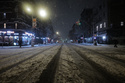Snow falls in the Alphabet City neighborhood of New York, Sunday evening, Feb. 22, 2026. (AP Photo/Patrick Sison)