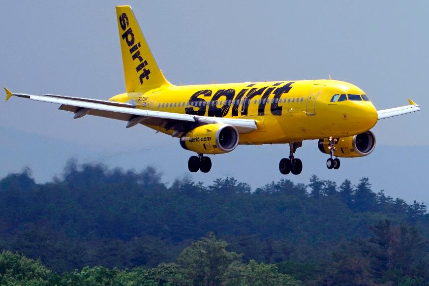FILE - A Spirit Airlines 319 Airbus approaches Manchester Boston Regional Airport for a landing, June 2, 2023, in Manchester, N.H. (AP Photo/Charles Krupa, File)
