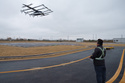 A pilot monitors the landing of a 5-ton class eVTOL aircraft at AutoFlight flight testing field in Shanghai, China, on Feb. 24, 2026. (AP Photo/Vincent Thian)