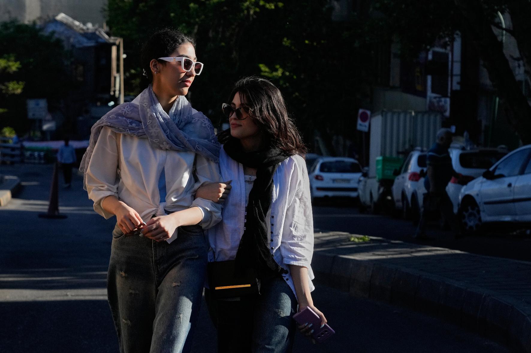 Women walk in northern Tehran, Iran, Sunday, May 10, 2026. (AP Photo/Vahid Salemi)