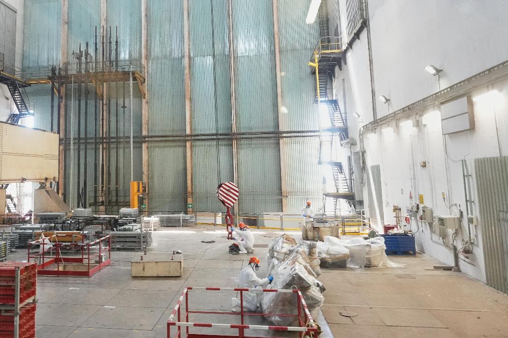 Workers package reactor components on the reactor operating floor of the former nuclear power plant of Latina, Italy, Thursday, June 18, 2026. (AP Photo/Alessandra Tarantino)