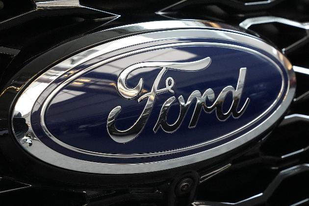 FILE - The Ford logo is seen on the grill of a Ford Explorer on display at the Pittsburgh International Auto Show, in Pittsburgh, on Feb. 15, 2024. (AP Photo/Gene J. Puskar, File)