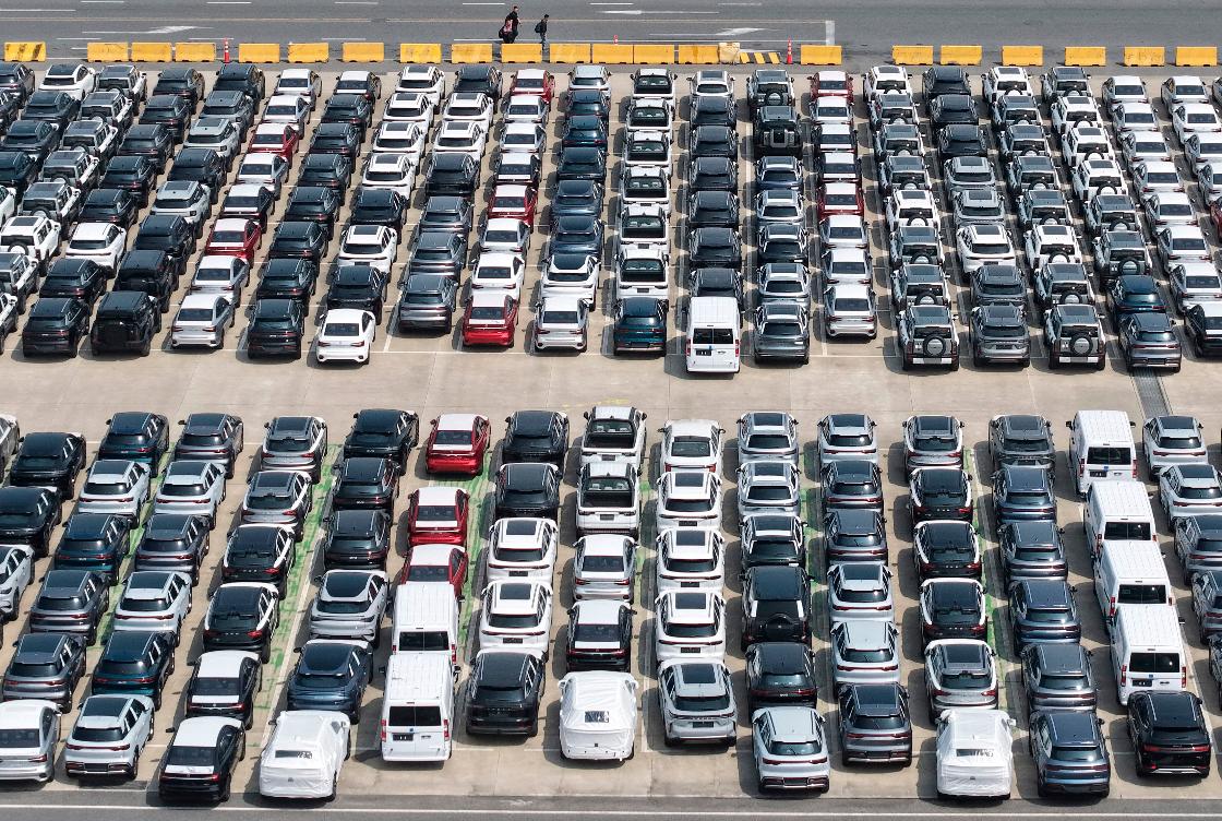 FILE - Aerial view of new vehicles waiting for shipment to overseas market at a port in Shanghai, China, May 9, 2026. (Chinatopix via AP, File)
