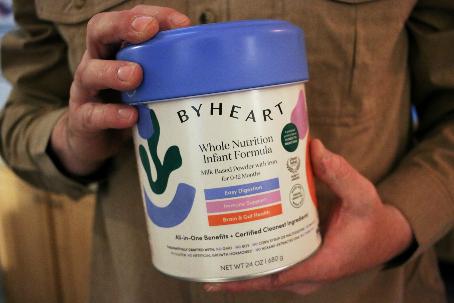 Stephen Dexter holds a container of ByHeart baby formula, which was recently recalled by ByHeart, in Flagstaff, Ariz., on Wednesday, Nov. 12, 2025. (AP Photo/Cheyanne Mumphrey)