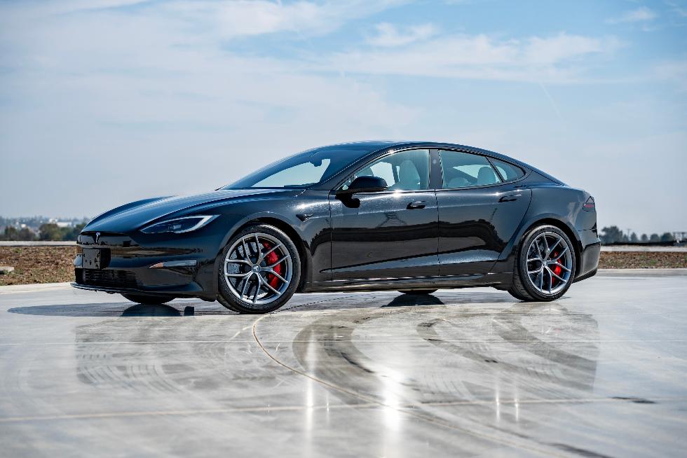 This photo provided by Tesla shows the Model S, one of the first mass-produced EVs. The base model has all-wheel drive and an EPA-estimated range of 410 miles. (Courtesy of Edmunds via AP)