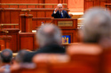 Romanian Prime Minister Ilie Bolojan addresses a parliament session ahead of a no confidence vote in Bucharest, Romania, Tuesday, May 5, 2026. (AP Photo/Vadim Ghirda)