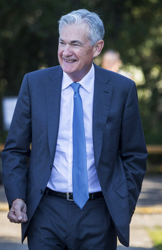 Federal Reserve Chair Jerome Powell smiles and walks after his speech at the central bank's annual symposium at Jackson Lake Lodge in Grand Teton National Park Friday, Aug. 26, 2022. in Moran, Wyo. (AP Photo/Amber Baesler)