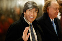 FILE - Pharmaceuticals billionaire Dr. Patrick Soon-Shiong waves as he arrives in the lobby of Trump Tower in New York for a meeting with President-elect Donald Trump on Jan. 10, 2017. (AP Photo/Evan Vucci, File)