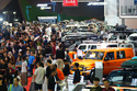 Visitors look at vehicles during a motor show in Jakarta, Indonesia, Feb. 7, 2026. (AP Photo/Tatan Syuflana)