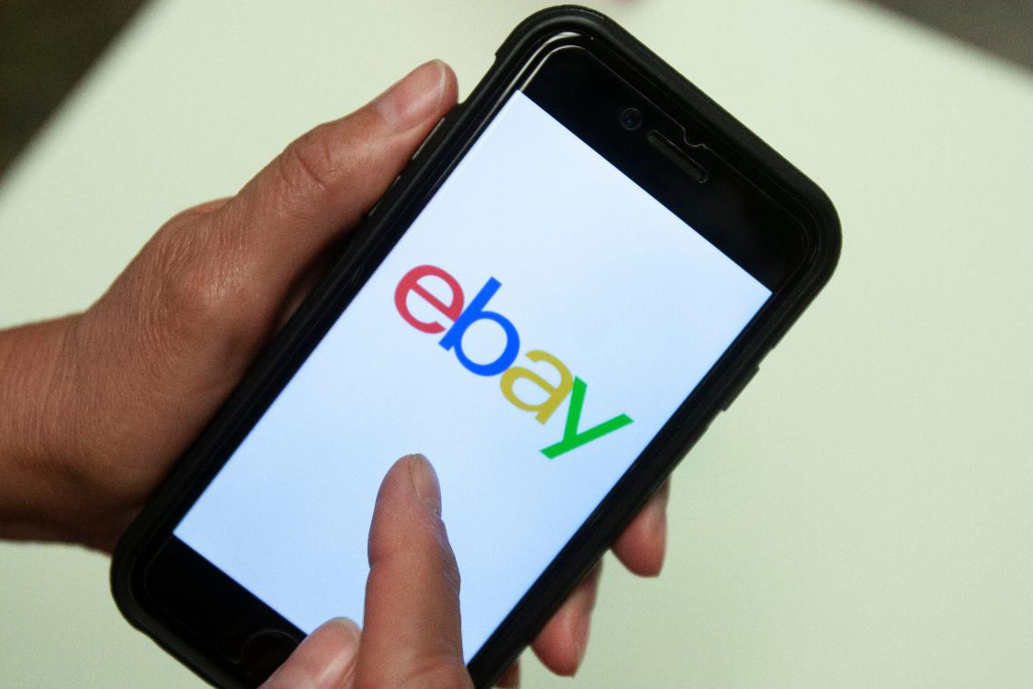 FILE - An Ebay app logo is shown on a mobile phone, July 11, 2019, in Miami. (AP Photo/Wilfredo Lee, File)