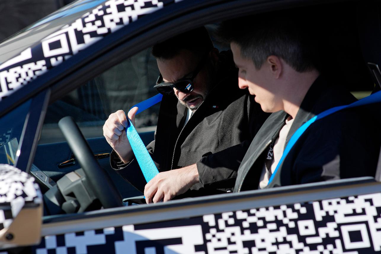 A person wears Xreal Air augmented reality glasses while taking an augmented reality driving demonstration at the BMW booth during the CES tech show Wednesday, Jan. 10, 2024, in Las Vegas. (AP Photo/John Locher)