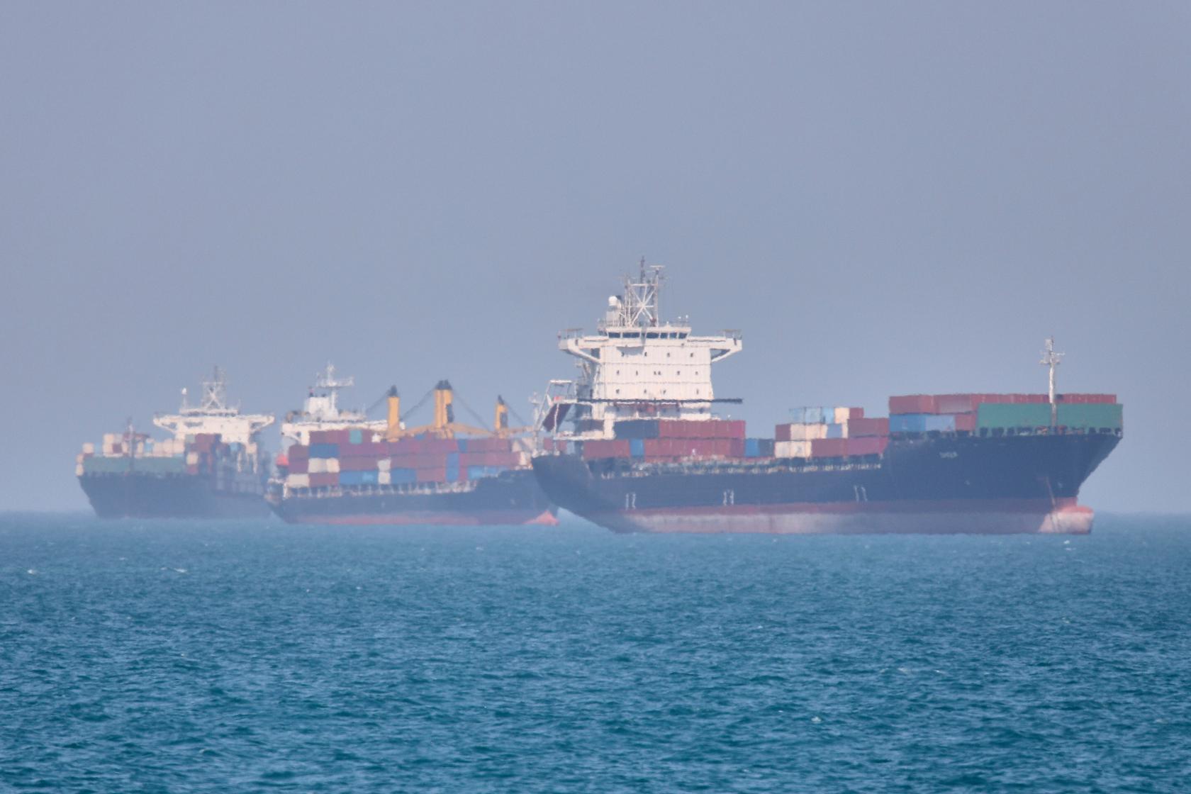 Container ships sit at anchor in the Strait of Hormuz off Bandar Abbas, Iran, Saturday, May 2, 2026.(Amirhosein Khorgooi/ISNA via AP)