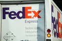 FILE - The company logo is shown on a FedEx delivery van, Sept. 13, 2023, in downtown Denver. (AP Photo/David Zalubowski, File)