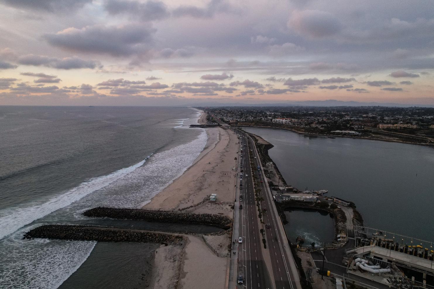 FILE - Carlsbad desalination plant's intake lagoon is visible on the right and the discharge canal on the left, Dec. 2, 2025, in Carlsbad, Calif. (AP Photo/Annika Hammerschlag, File)